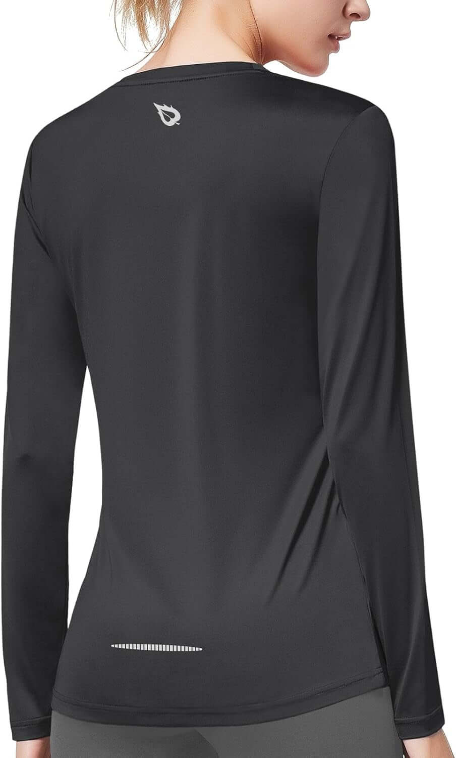 Back view of women's quick dry workout top in black, showcasing long sleeves and stylish design.