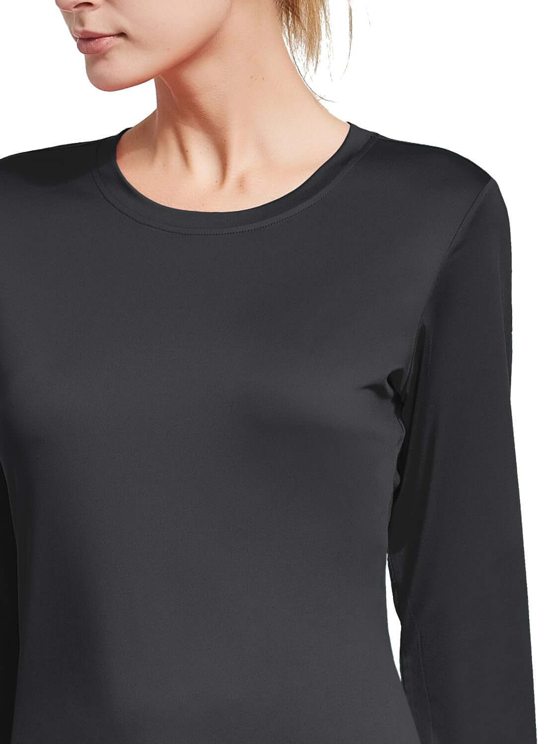 Back view of women's quick dry workout top in black, showcasing long sleeves and stylish design.